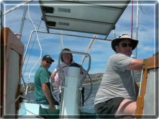 Ann on the wheel and Tertius trimming the sheets (ropes)